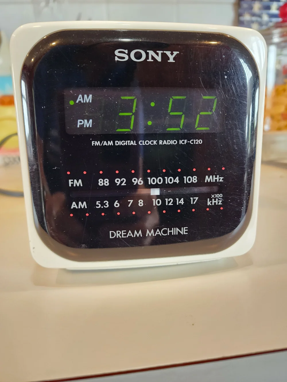 Vintage Sony White Clock Radio with Black Display and Green LEDs